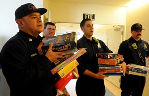 Firefighters delivering toys