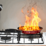Fire in a pan on a stove