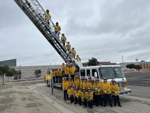 Explorers group picture with a fire engine
